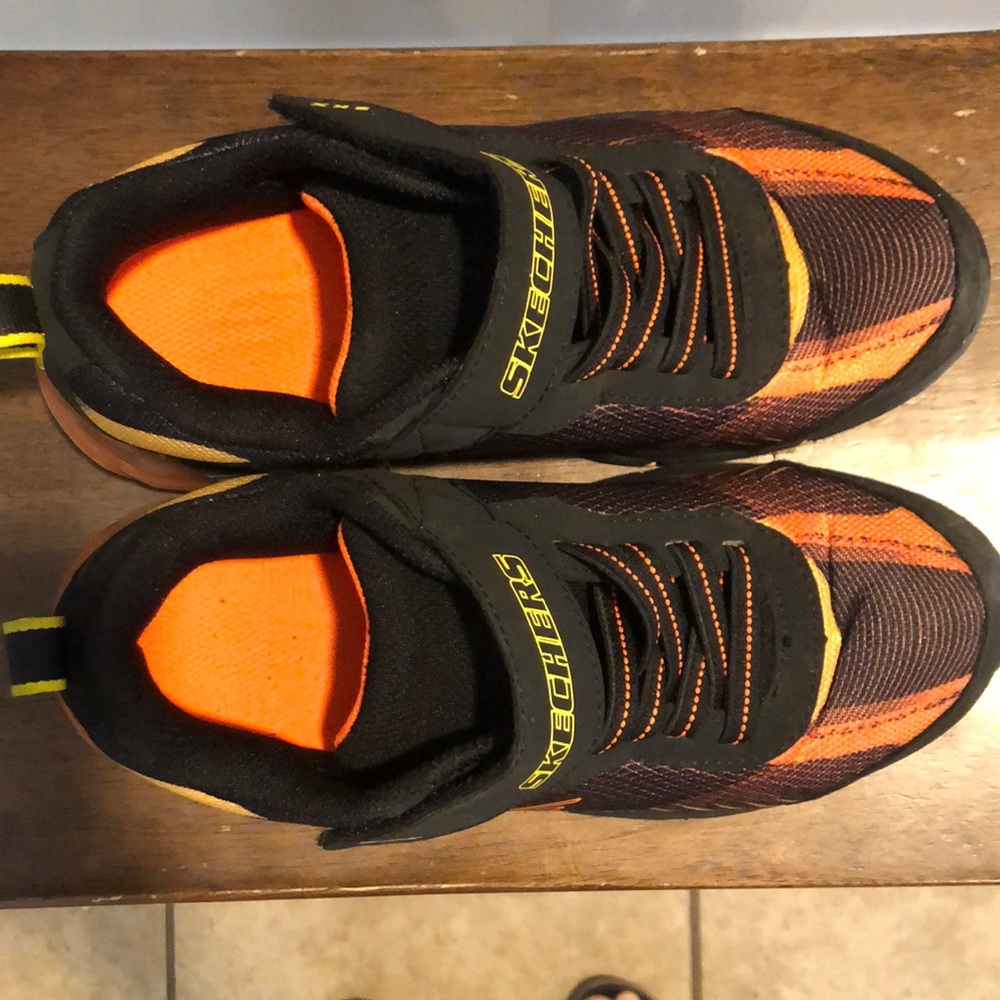 Orange and black sketchers size 2